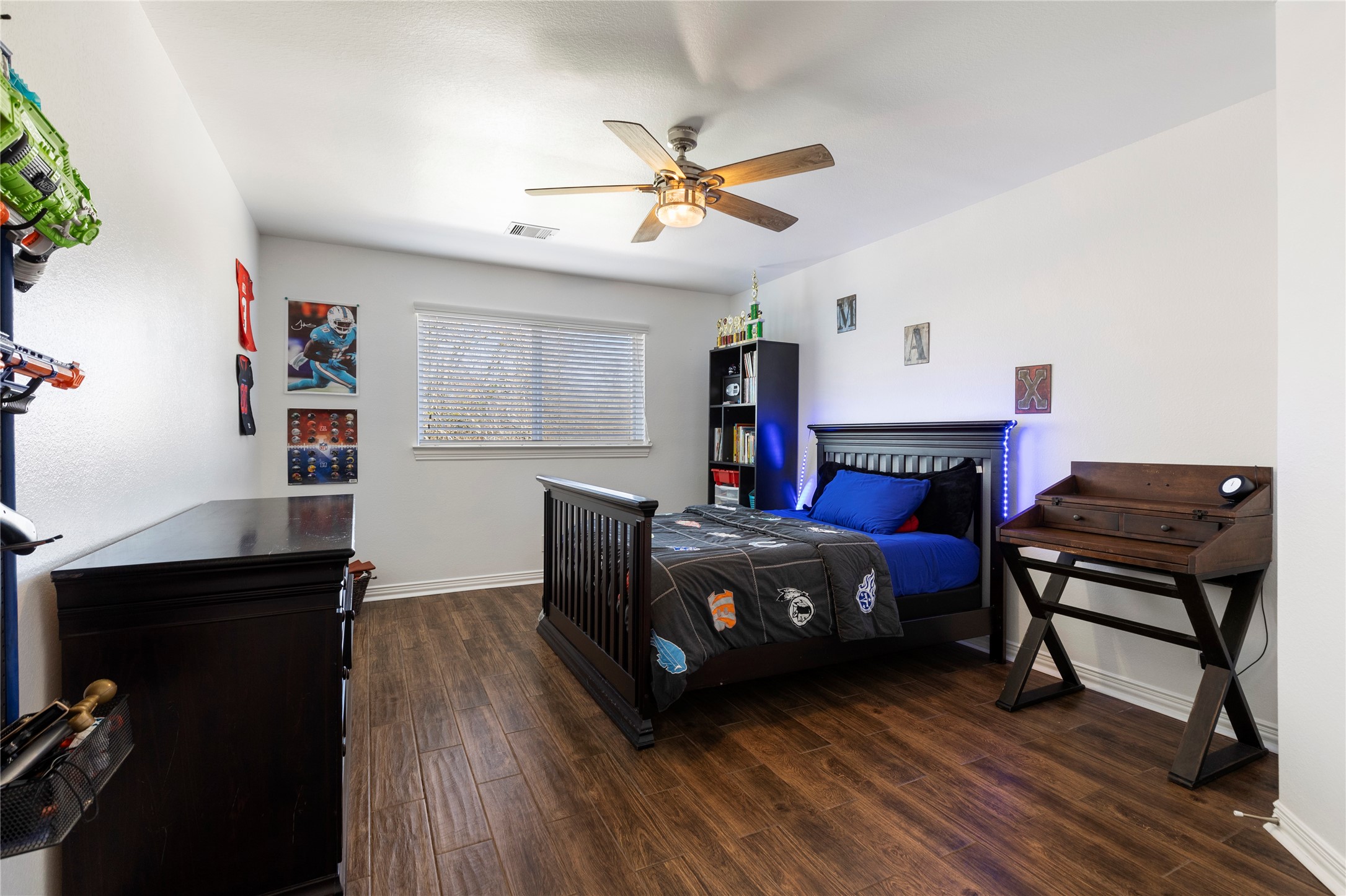 36345 Lady J Circle Wallis, TX 77485 - Photo 28 of 50 a living room with furniture a fireplace and a flat screen tv