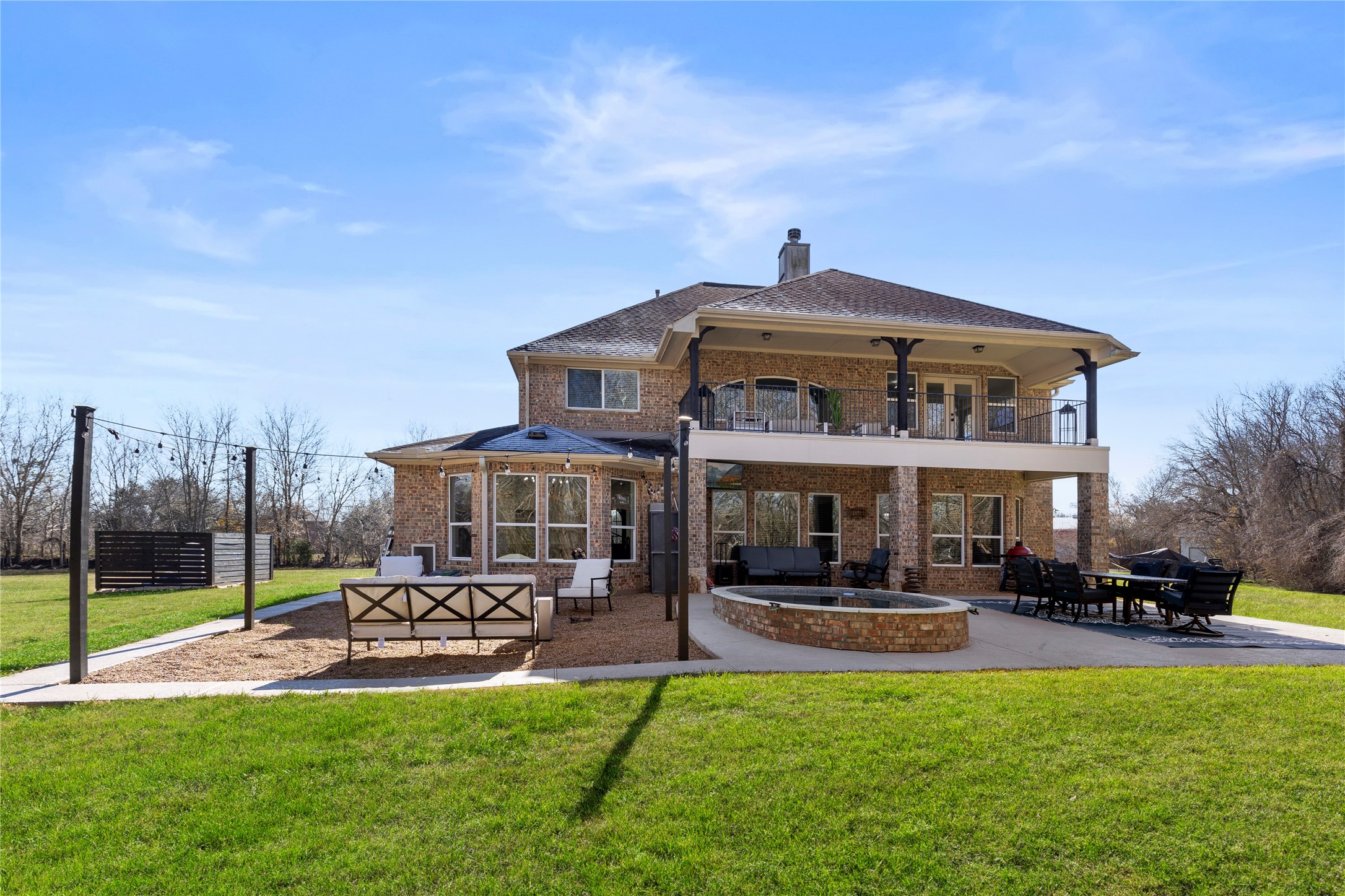 36345 Lady J Circle Wallis, TX 77485 - Photo 40 of 50 a view of a big yard with table and chairs under an umbrella