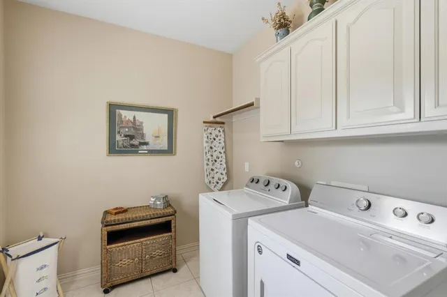 a view of storage and utility room with washer and dryer
