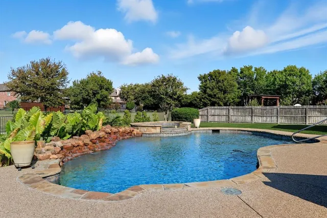 a view of a swimming pool with a patio