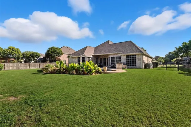a view of a house with a big yard