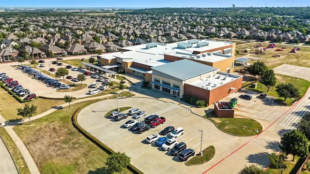 an aerial view of a dinning table and chairs