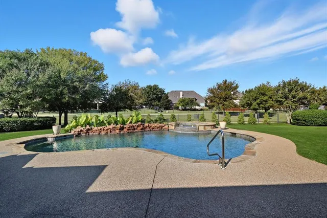 a view of a swimming pool with a patio