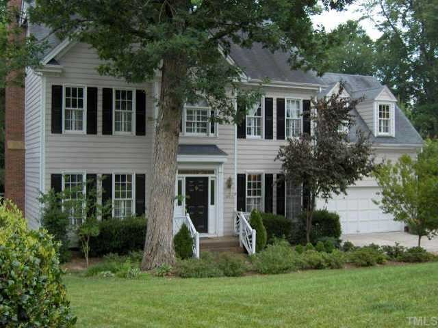 8005 Morgans Way Raleigh, NC 27615 - Photo 1 of 1 a front view of house with a garden