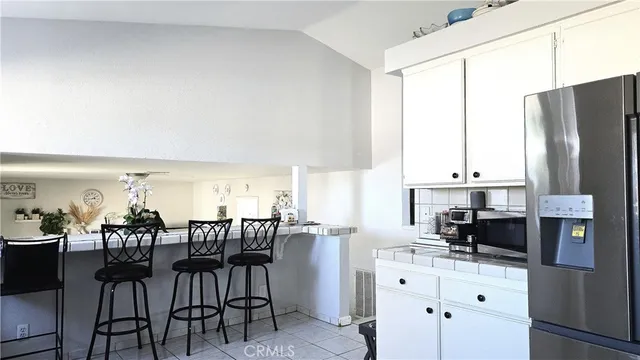 a bathroom with a sink mirror vanity and toilet