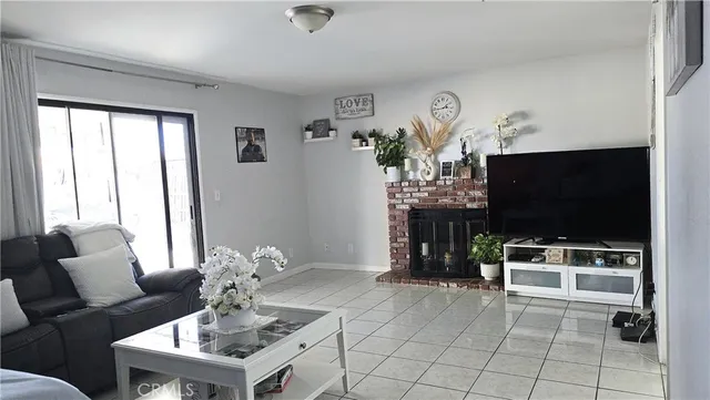 a bedroom with a bed and a television