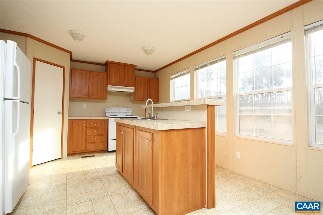 8568 Venable Road Kents Store, VA 23084 - Photo 3 of 11 a kitchen with stainless steel appliances granite countertop a refrigerator and a sink