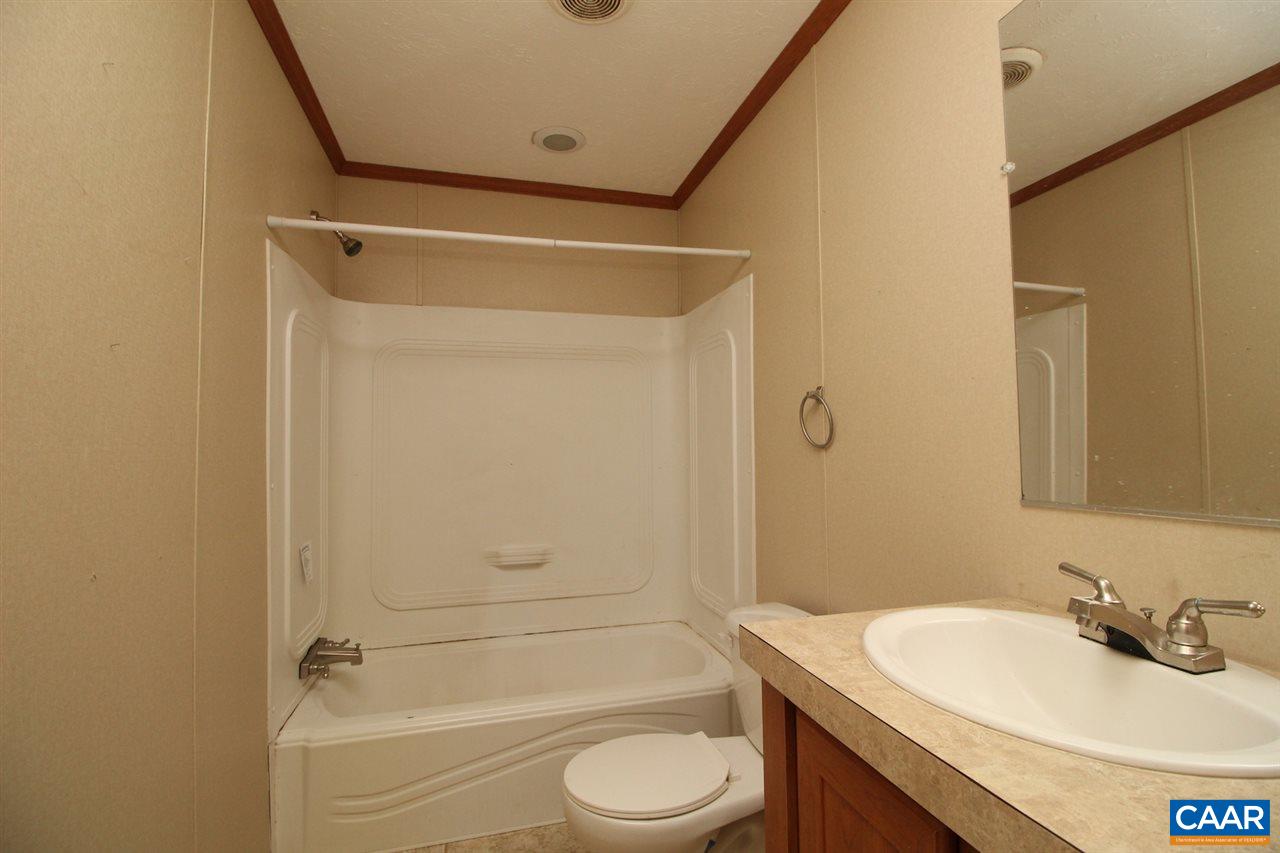 8568 Venable Road Kents Store, VA 23084 - Photo 6 of 11 a bathroom with a sink toilet and shower
