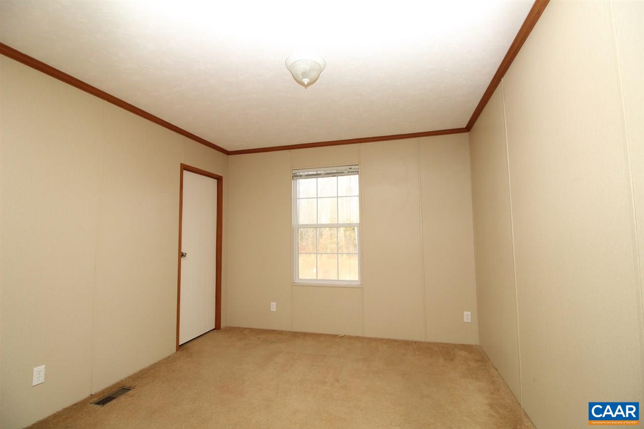 8568 Venable Road Kents Store, VA 23084 - Photo 8 of 11 an empty room with windows