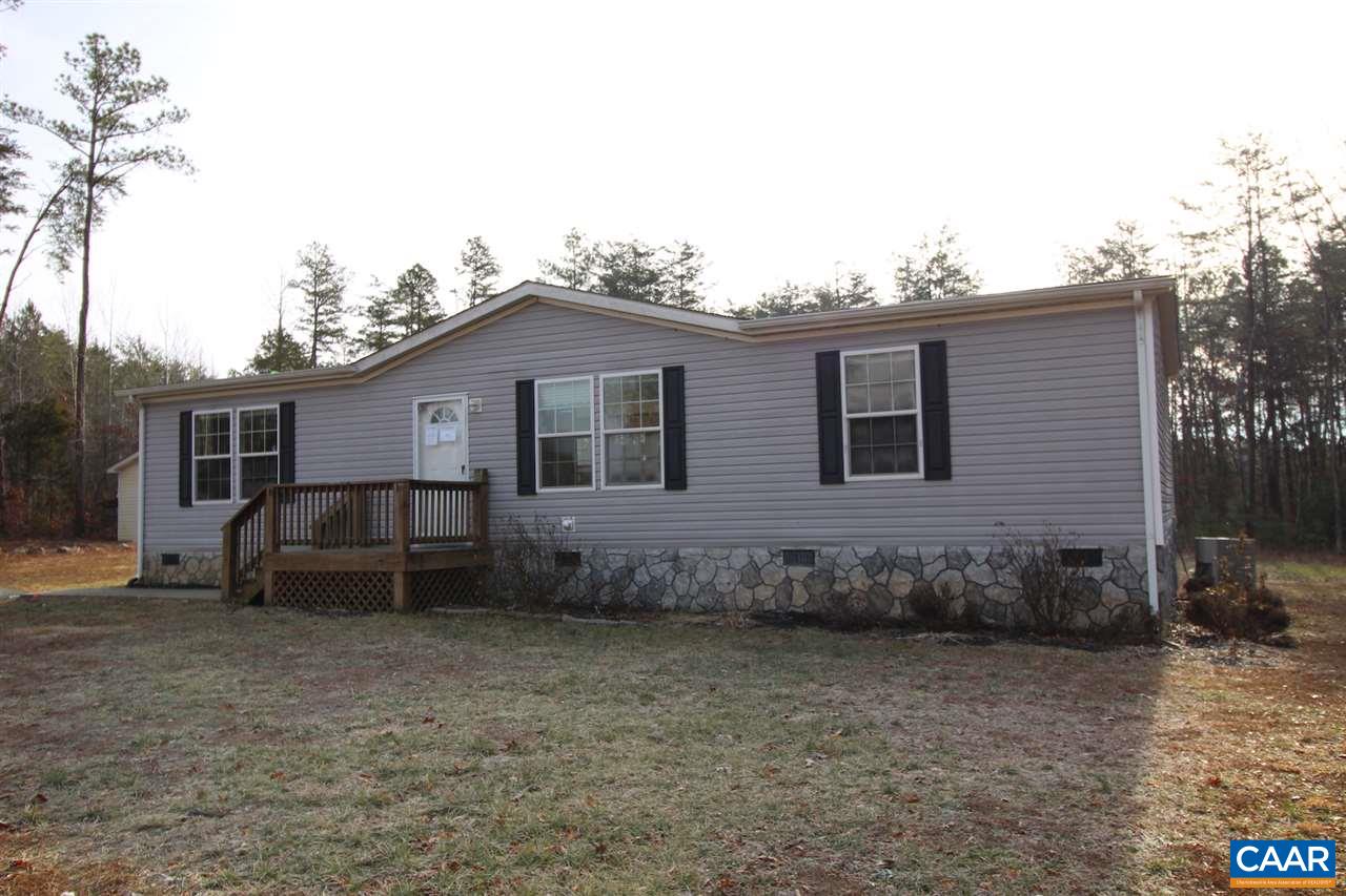 8568 Venable Road Kents Store, VA 23084 - Photo 9 of 11 a front view of a house with a garden