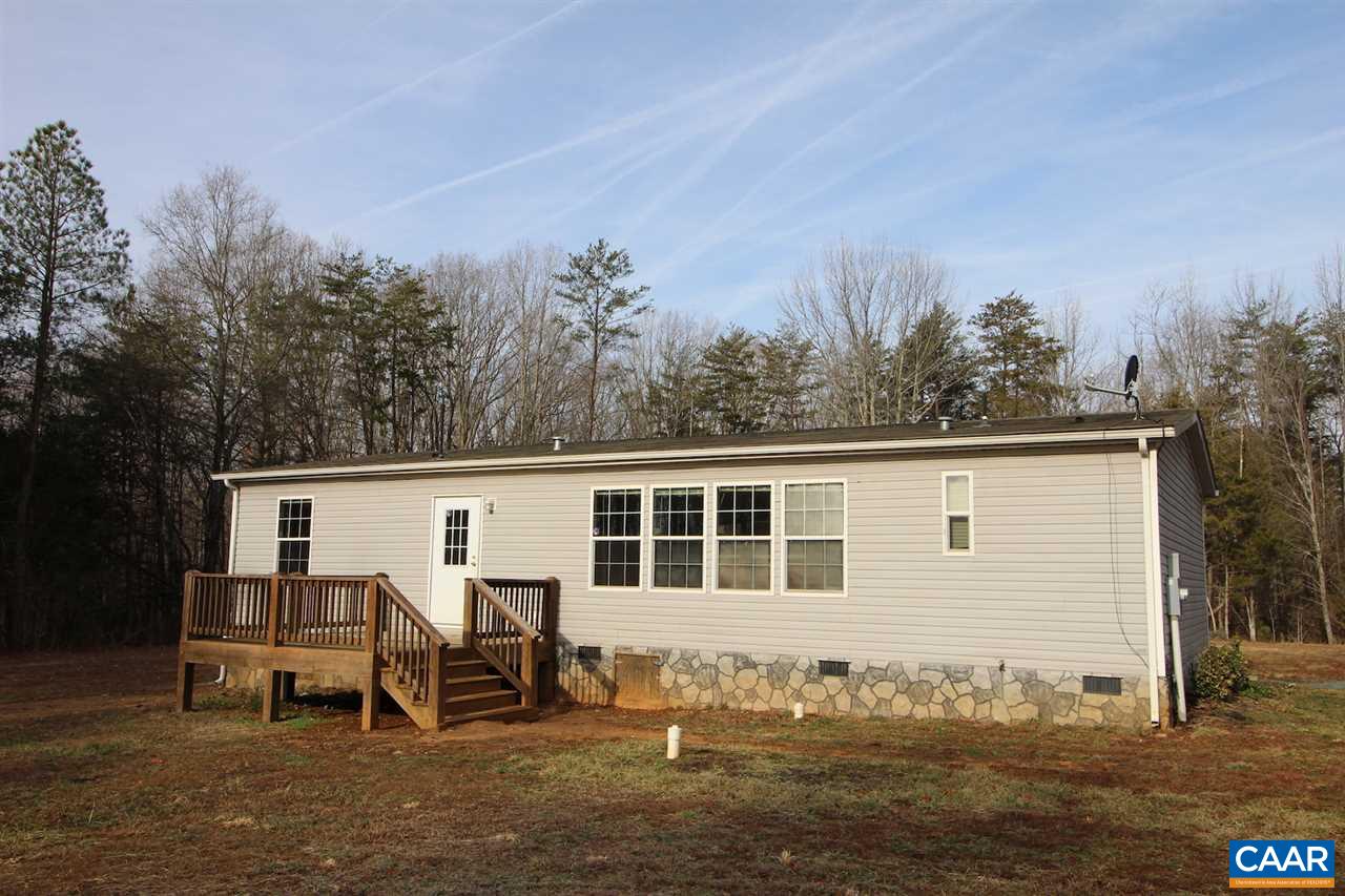 8568 Venable Road Kents Store, VA 23084 - Photo 10 of 11 a backyard of a house with table and chairs