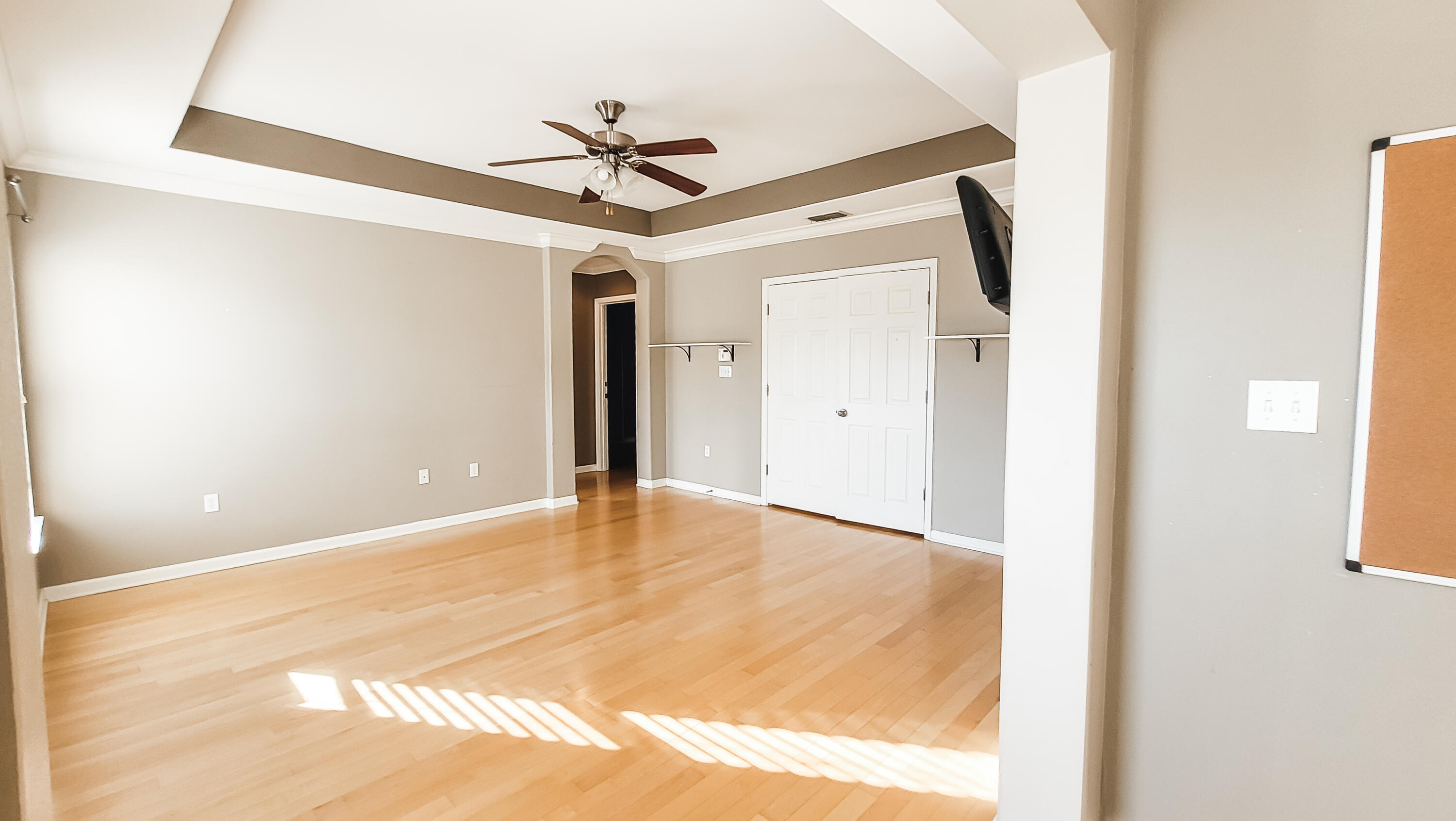 898 Solimar Way Mary Esther, FL 32569 - Photo 17 of 35 a view of a big room with wooden floor and windows in a room