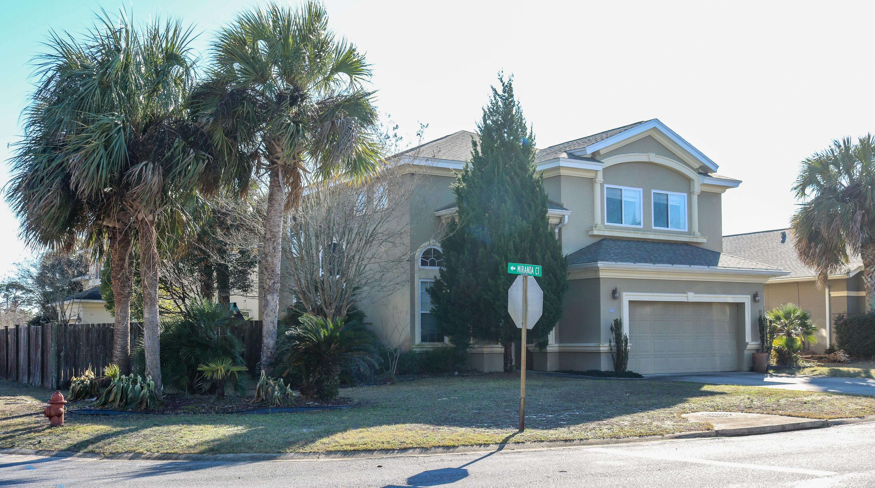 898 Solimar Way Mary Esther, FL 32569 - Photo 2 of 35 a front view of a house with garden