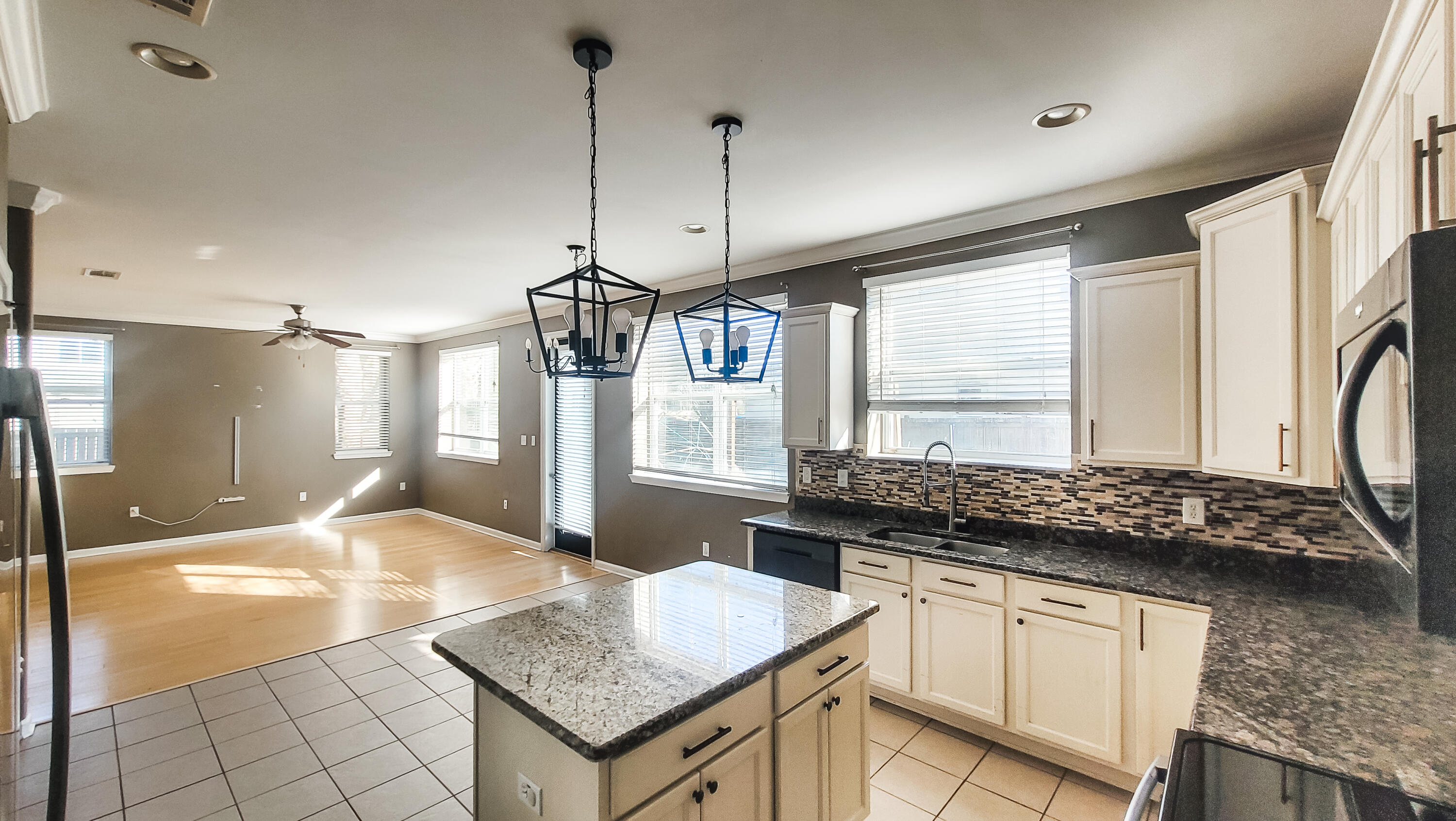 898 Solimar Way Mary Esther, FL 32569 - Photo 7 of 35 a kitchen with granite countertop a stove a sink and a refrigerator