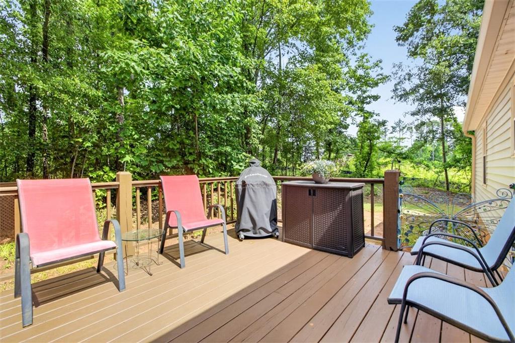 3771 Castleberry Road Cumming, GA 30040 - Photo 43 of 69 a view of a deck with wooden floor and furniture
