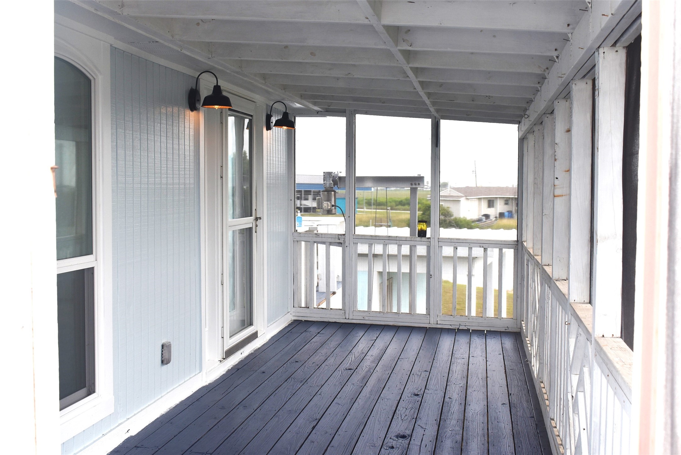 11 Chimaera Street Sargent, TX 77414 - Photo 14 of 43 Don't have to worry about mosquitos! Covered and screened for sitting out in the evening or in the morning drinking that first cup of coffee!