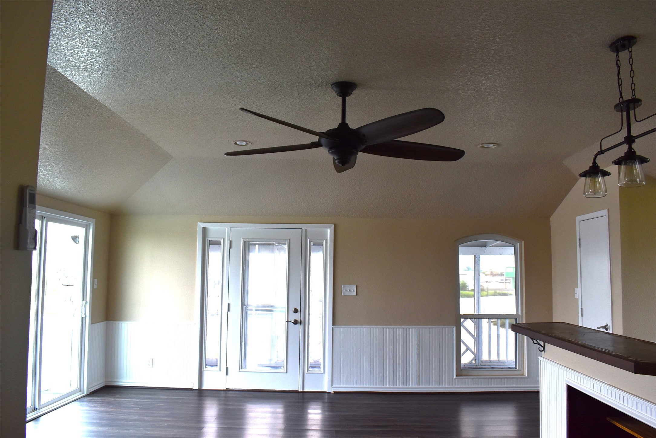 11 Chimaera Street Sargent, TX 77414 - Photo 26 of 43 Raised ceilings with new ceiling fan, bright and cheerful living area with breakfast nook or extra seating