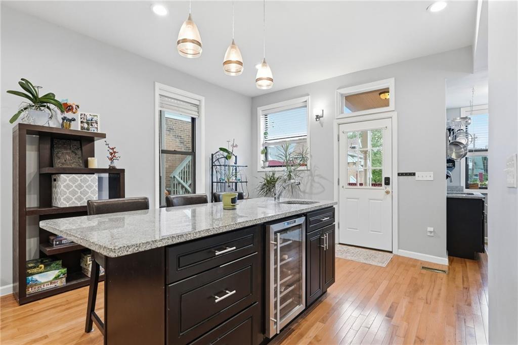 5443 Jackson Street Pittsburgh, PA 15206 - Photo 12 of 46 Kitchen island with wine fridge
