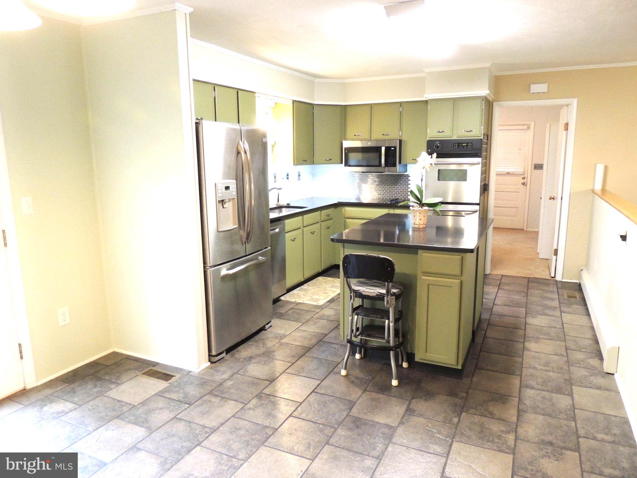 5838 Oklahoma Road Sykesville, MD 21784 - Photo 14 of 72 Charming kitchen with modern flair.