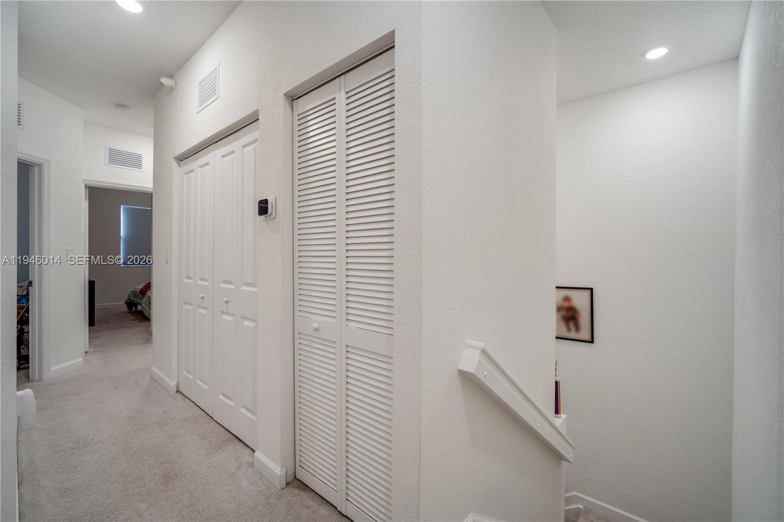 28574 Southwest 134th Court, Unit 28574 Homestead, FL 33033 - Photo 13 of 29 a view of a hallway with bathroom