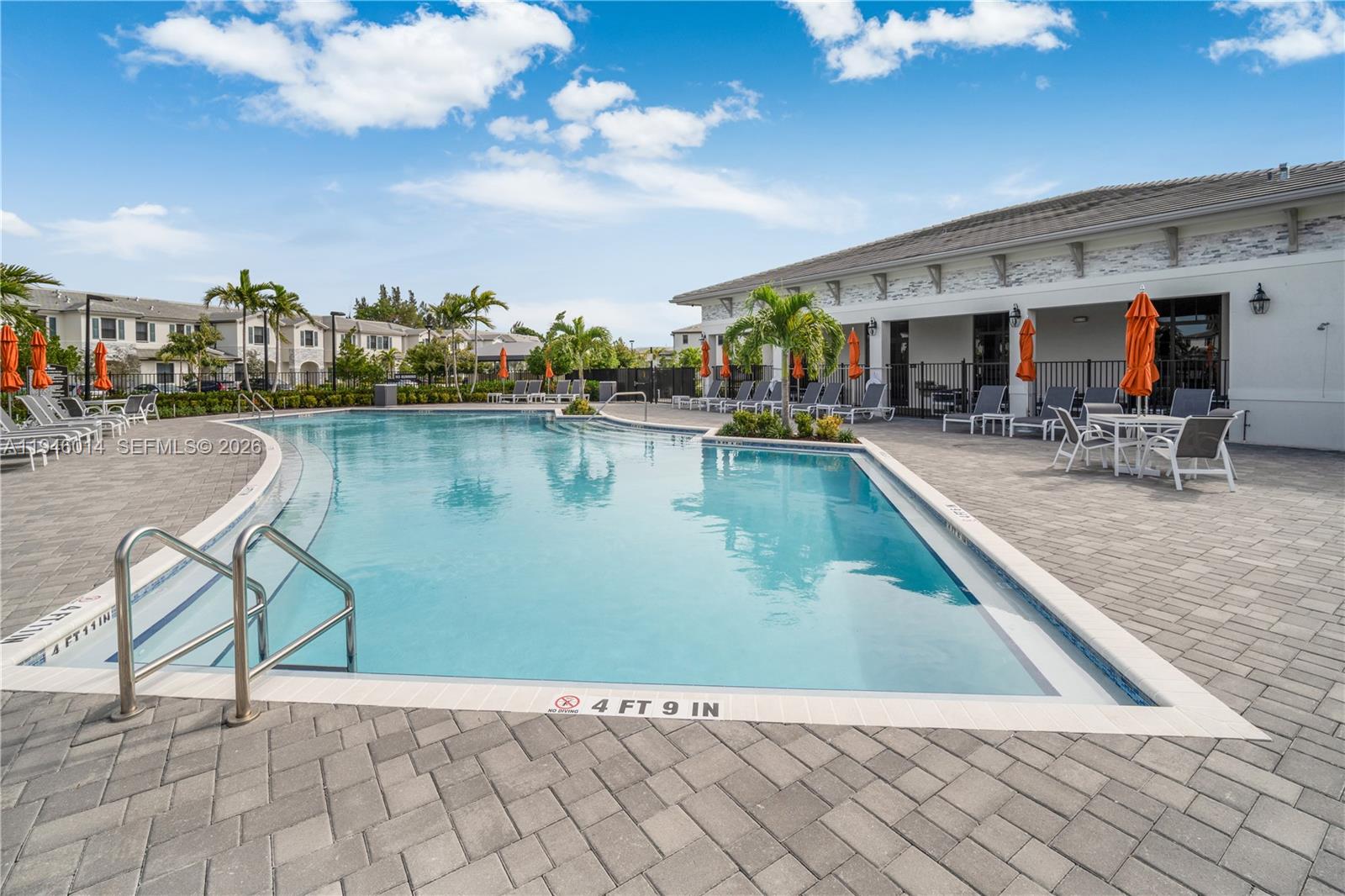28574 Southwest 134th Court, Unit 28574 Homestead, FL 33033 - Photo 26 of 29 a view of a swimming pool with outdoor seating