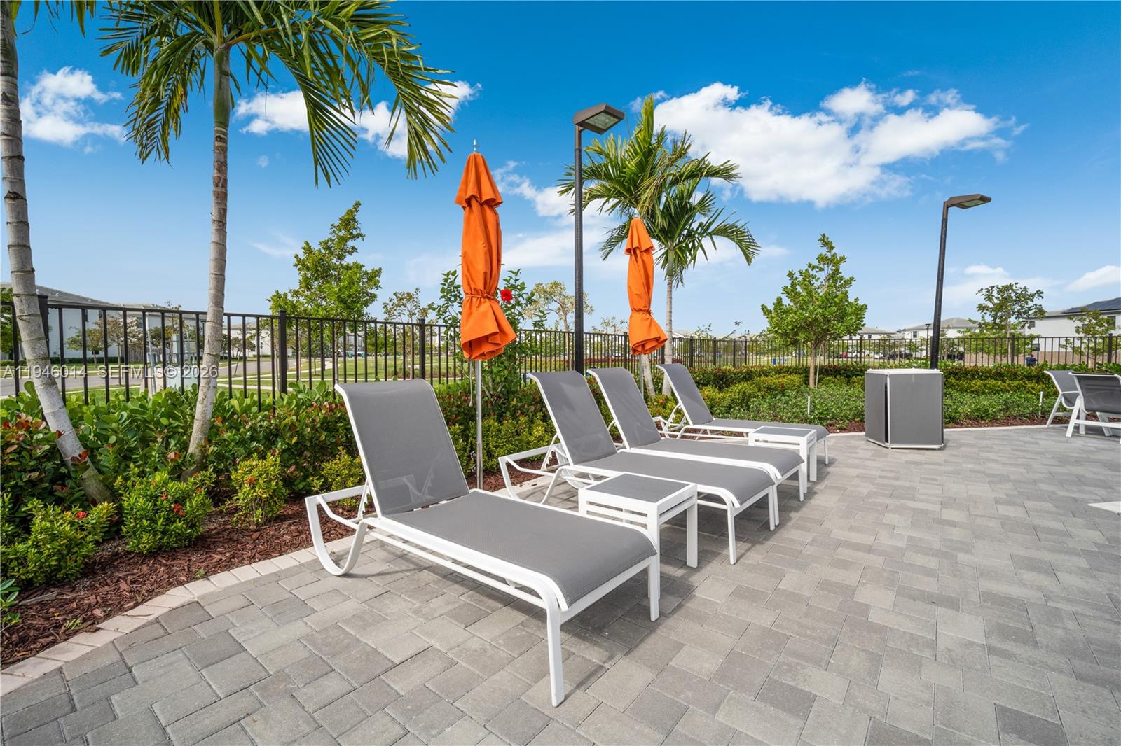28574 Southwest 134th Court, Unit 28574 Homestead, FL 33033 - Photo 27 of 29 a view of a patio with a table and chairs