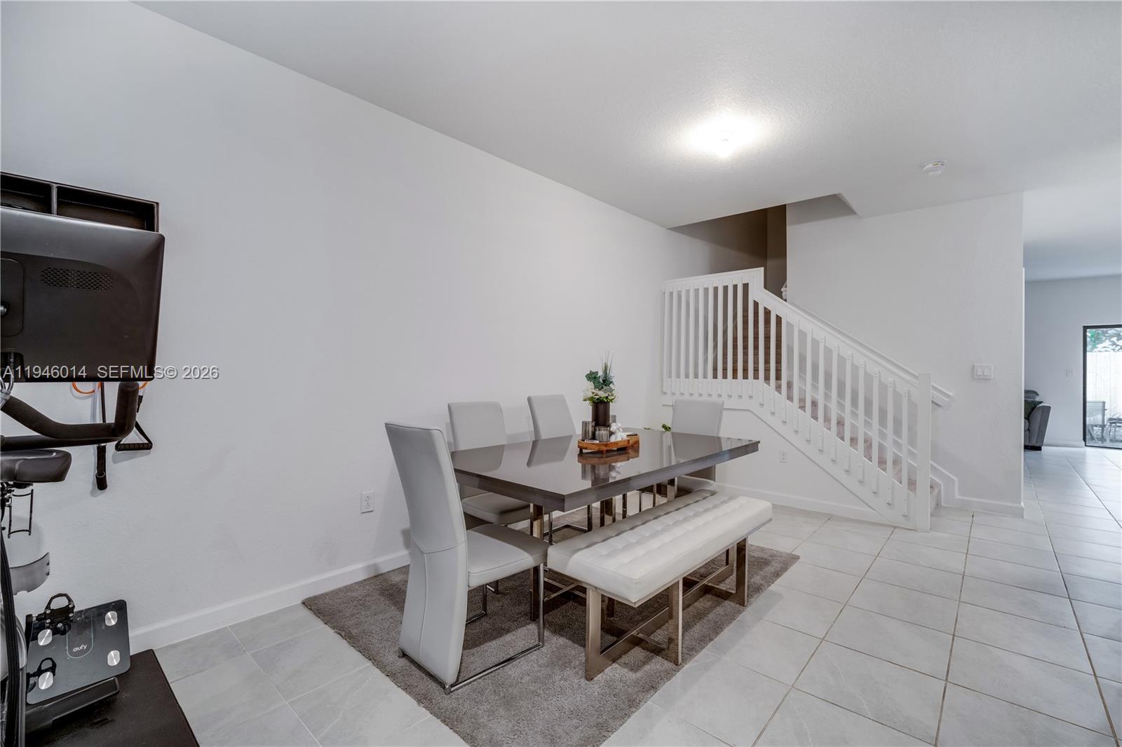 28574 Southwest 134th Court, Unit 28574 Homestead, FL 33033 - Photo 3 of 29 a dining room with furniture and wooden floor