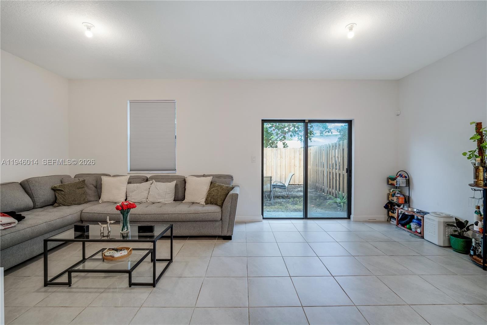 28574 Southwest 134th Court, Unit 28574 Homestead, FL 33033 - Photo 10 of 29 a living room with furniture and a potted plant