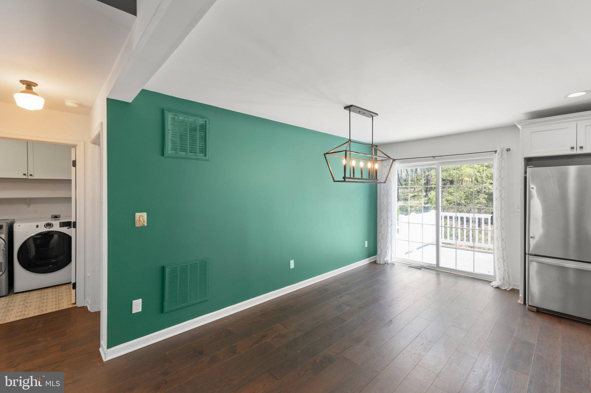 112 Colonial Drive Cross Junction, VA 22625 - Photo 11 of 45 a kitchen with a refrigerator and a wooden floor