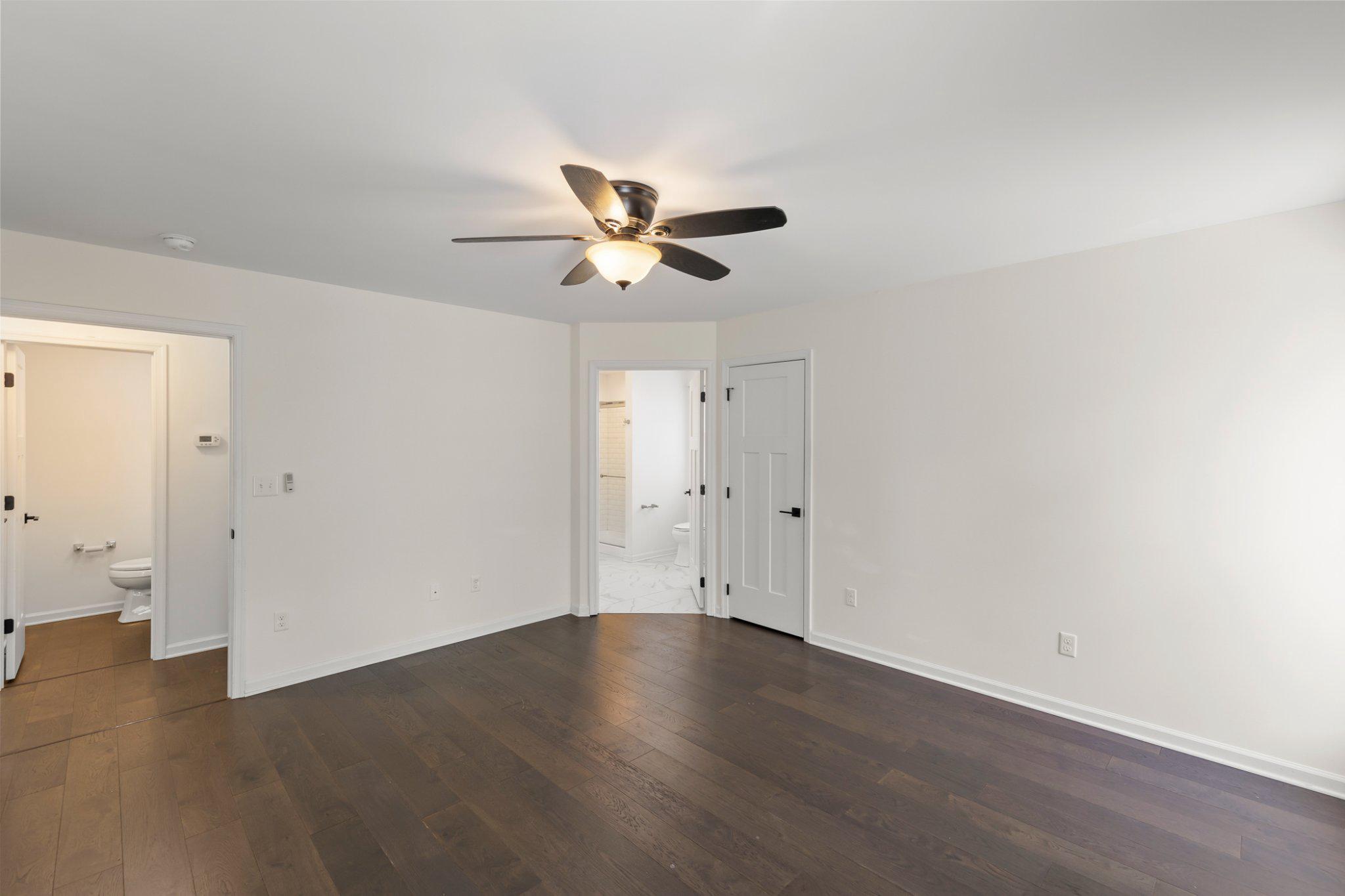 112 Colonial Drive Cross Junction, VA 22625 - Photo 15 of 45 an empty room with wooden floor and ceiling fan