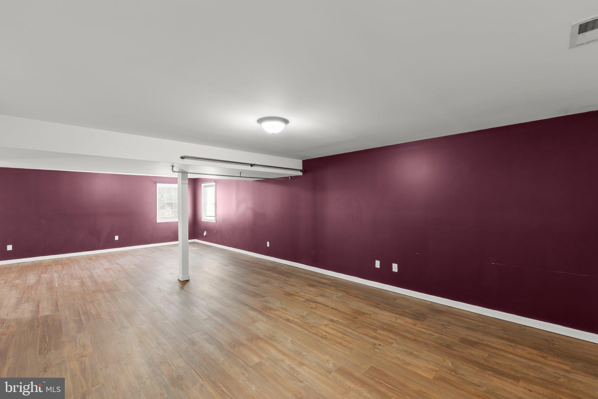 112 Colonial Drive Cross Junction, VA 22625 - Photo 21 of 45 an empty room with wooden floor and windows