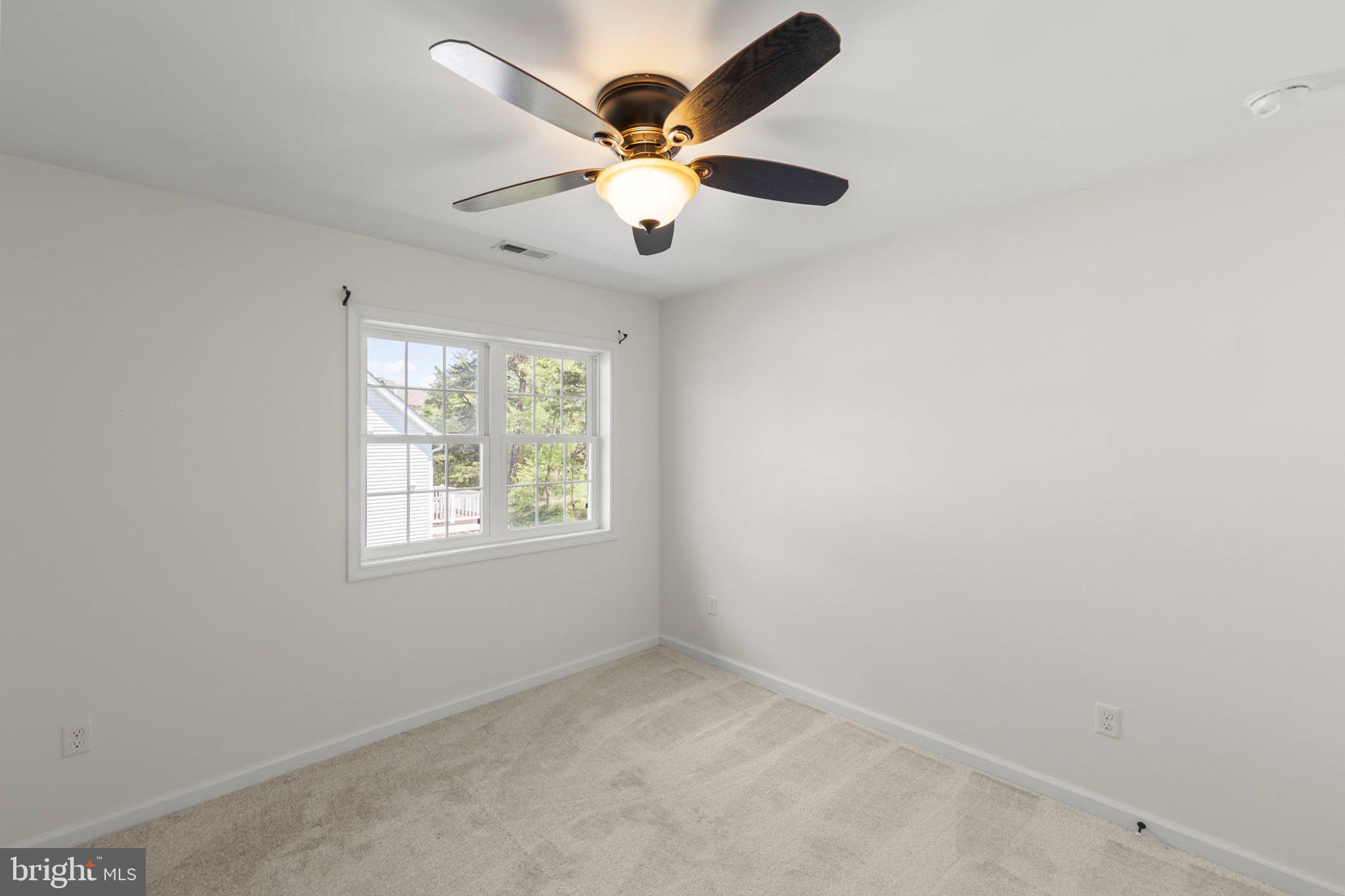 112 Colonial Drive Cross Junction, VA 22625 - Photo 28 of 45 an empty room with windows and fan