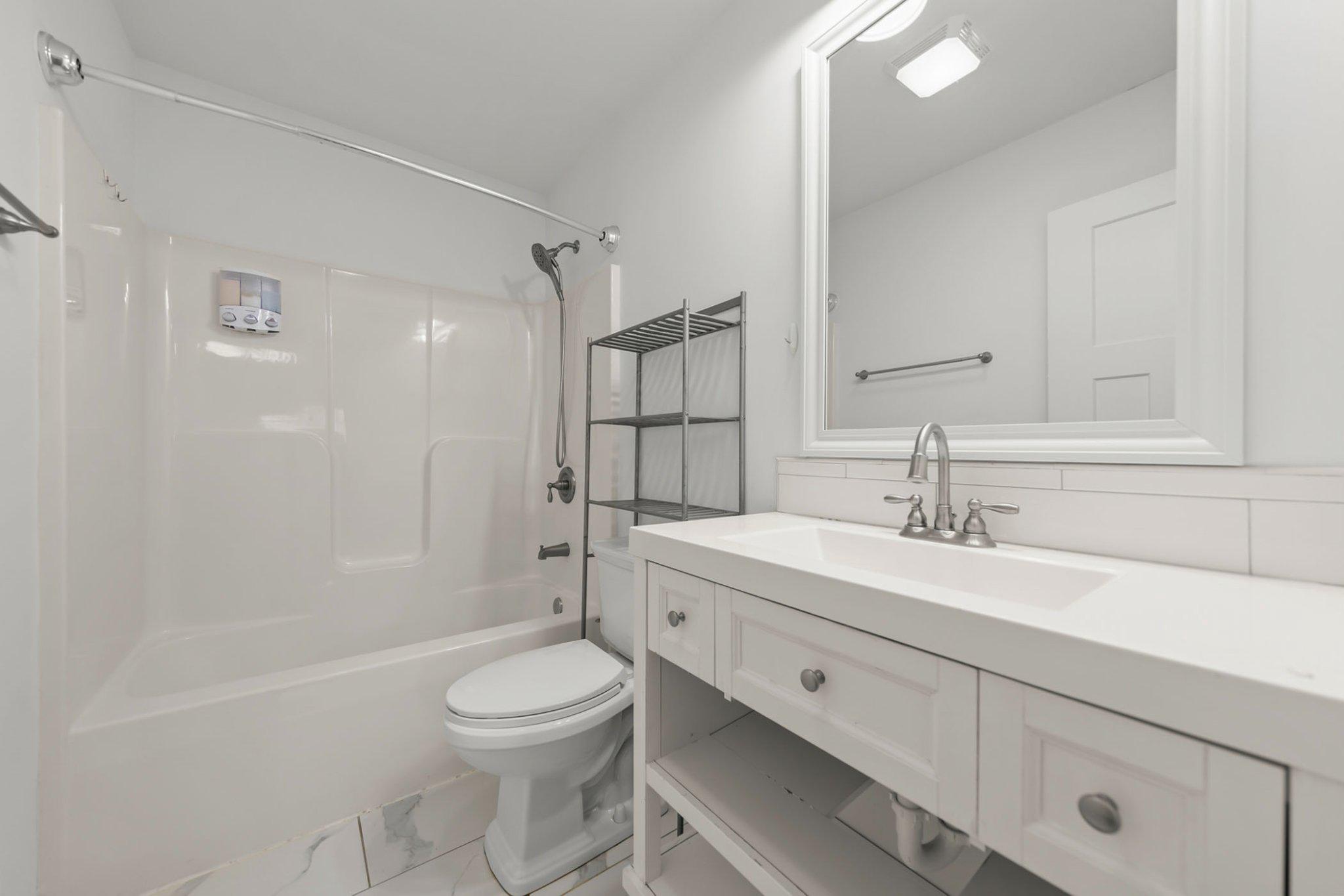 112 Colonial Drive Cross Junction, VA 22625 - Photo 36 of 45 a bathroom with a sink a toilet and shower