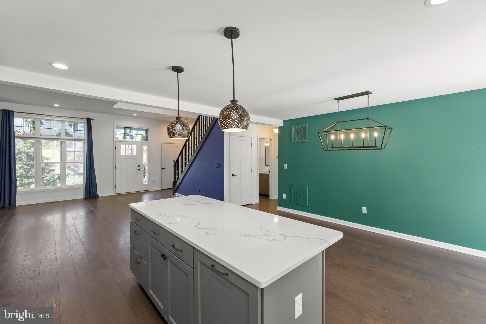 112 Colonial Drive Cross Junction, VA 22625 - Photo 10 of 45 a kitchen with a wooden floor and a chandelier
