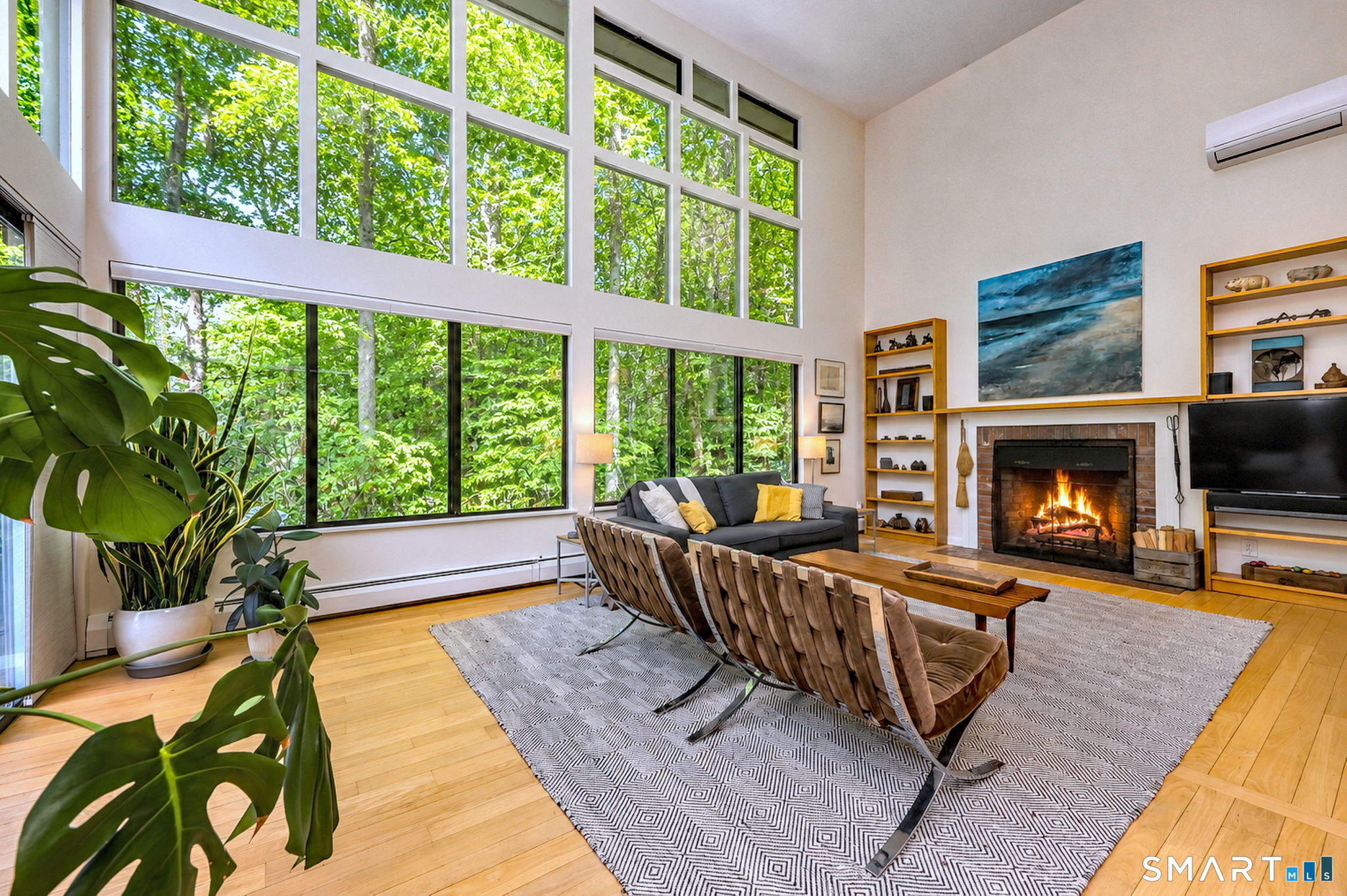 95 Thankful Stow Road Guilford, CT 06437 - Photo 5 of 40 Walls of windows, Builtins, wood burning fireplace
