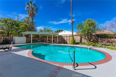 a view of a swimming pool with a patio