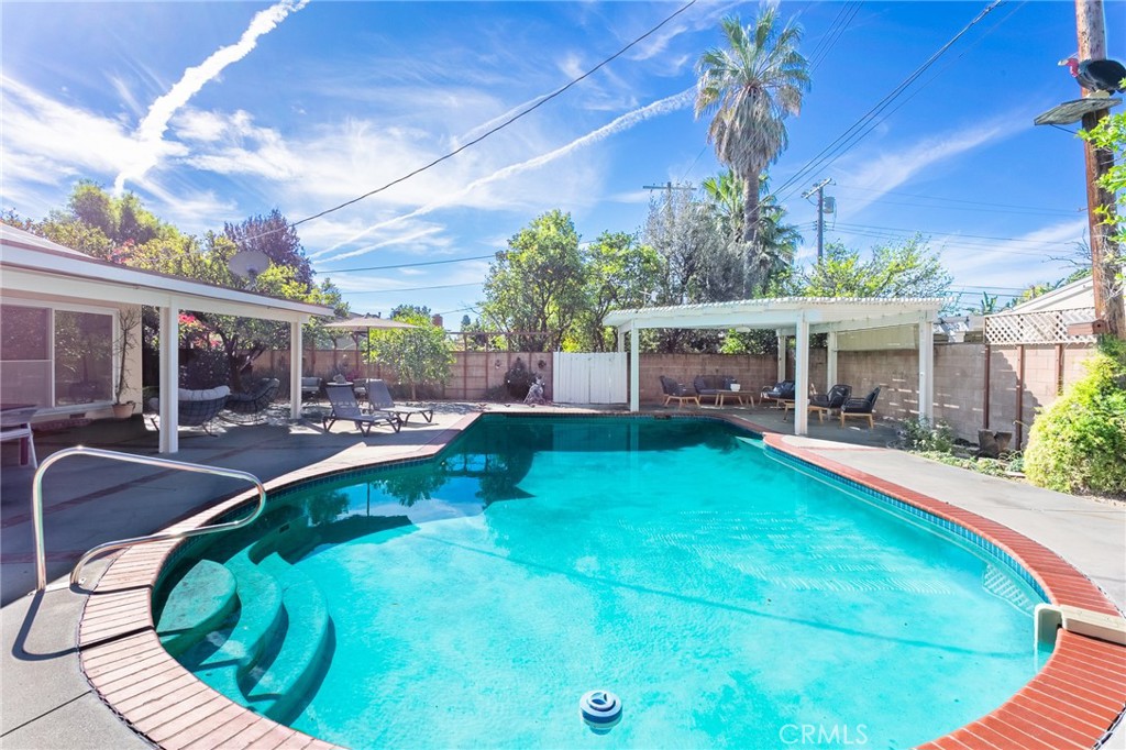 11017 Baird Avenue Porter Ranch, CA 91326 - Photo 19 of 35 a view of a house with swimming pool and sitting area