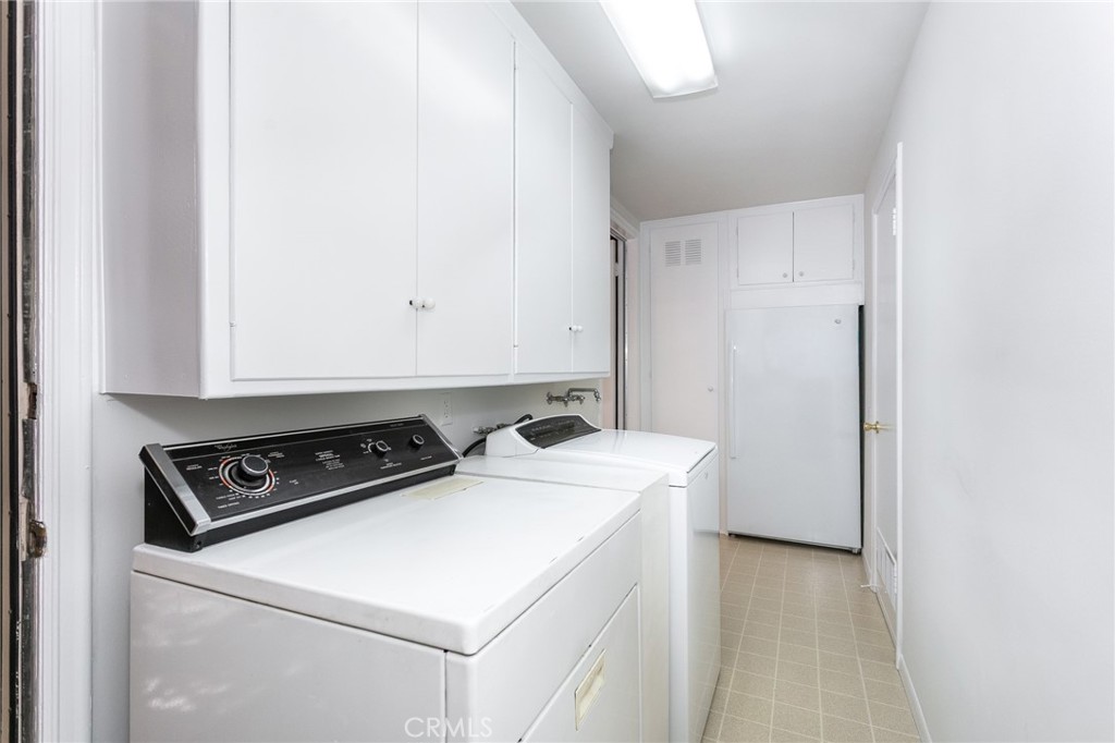 11017 Baird Avenue Porter Ranch, CA 91326 - Photo 21 of 35 a utility room with dryer and washer