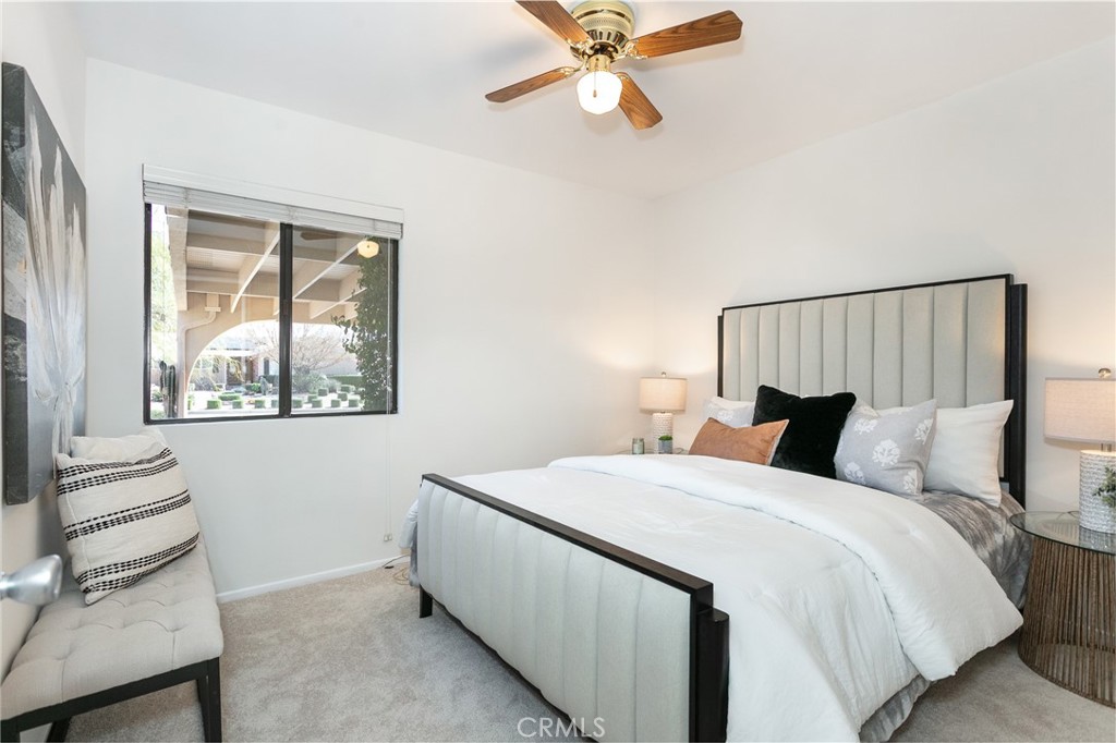 11017 Baird Avenue Porter Ranch, CA 91326 - Photo 27 of 35 a bedroom with a bed and a window