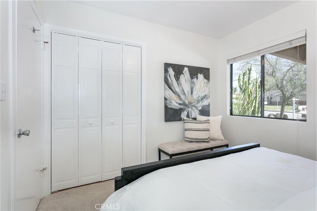 11017 Baird Avenue Porter Ranch, CA 91326 - Photo 28 of 35 a bedroom with a bed and a window