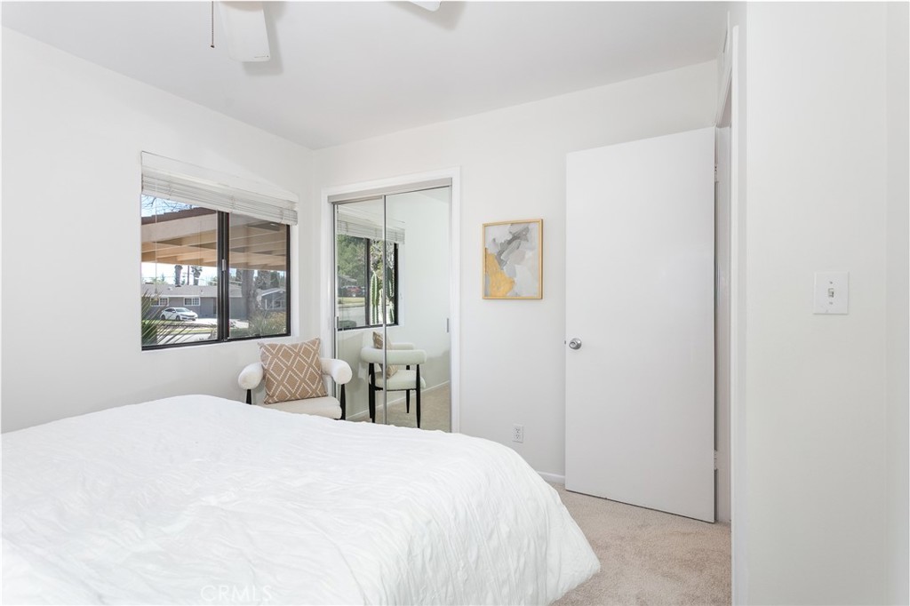 11017 Baird Avenue Porter Ranch, CA 91326 - Photo 30 of 35 a bedroom with a large bed and a window