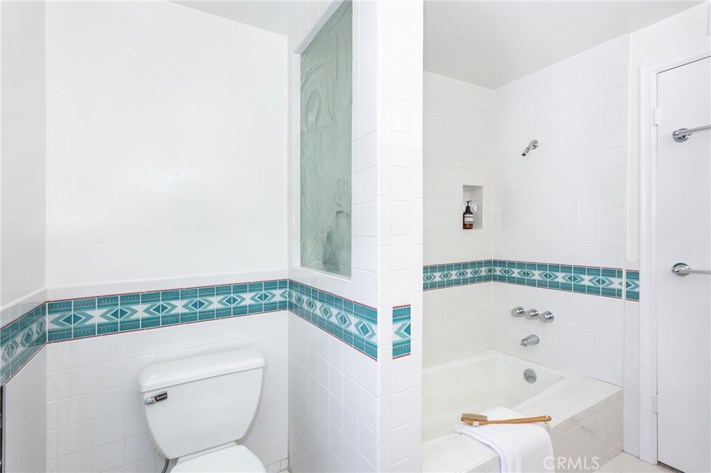 11017 Baird Avenue Porter Ranch, CA 91326 - Photo 32 of 35 a bathroom with a toilet and a shower