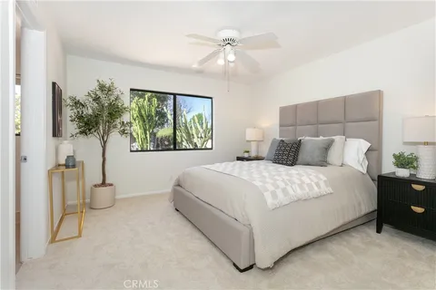 a spacious bedroom with a bed and a shower