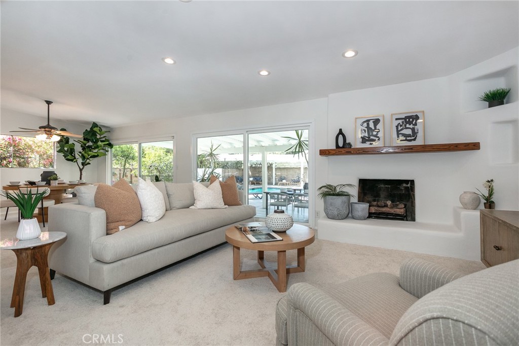 11017 Baird Avenue Porter Ranch, CA 91326 - Photo 4 of 35 a living room with furniture and a fireplace