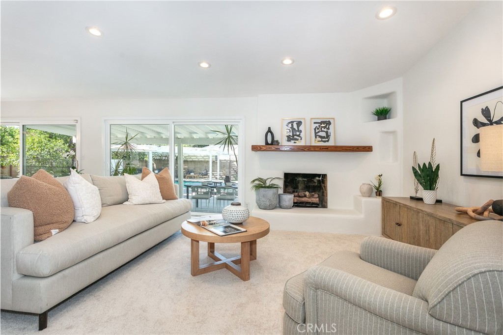 11017 Baird Avenue Porter Ranch, CA 91326 - Photo 5 of 35 a living room with furniture and a fireplace