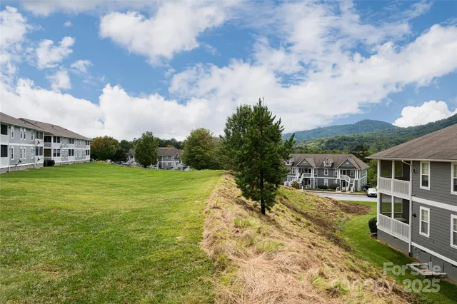 a view of a town with barn house