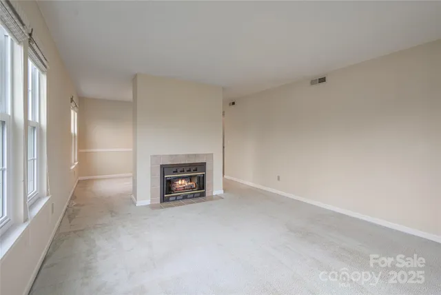 an empty room with a fireplace