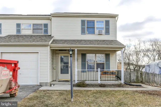 a front view of a house with a porch