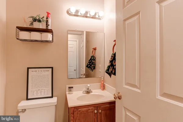 a bathroom with a sink vanity and a mirror