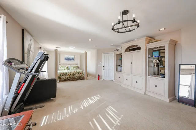 a view of a livingroom with furniture and a ceiling fan